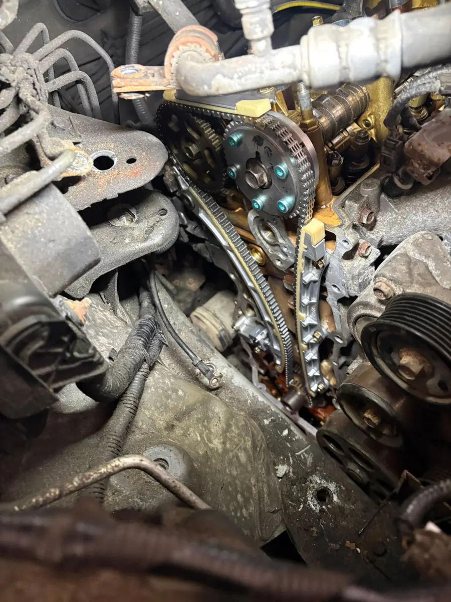 Engine timing components and chain exposed during work at AutoNorth Auto Repair in North Bay